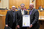 Photo of Councilmember Sherman Presenting David Akin with the David Akin Day Proclamation