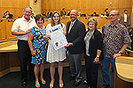 Photo of Councilmember Sherman presenting Lara Webster with a proclamation declaring July 30th Lara Webster Day in the City of San Diego