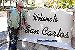 Photo of Councilmember Sherman helping put the last letters into place for the San Carlos Sign repairs