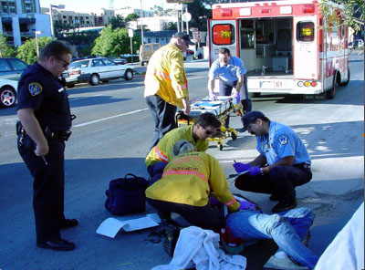 Photo of medical technicians treating an inebriated person